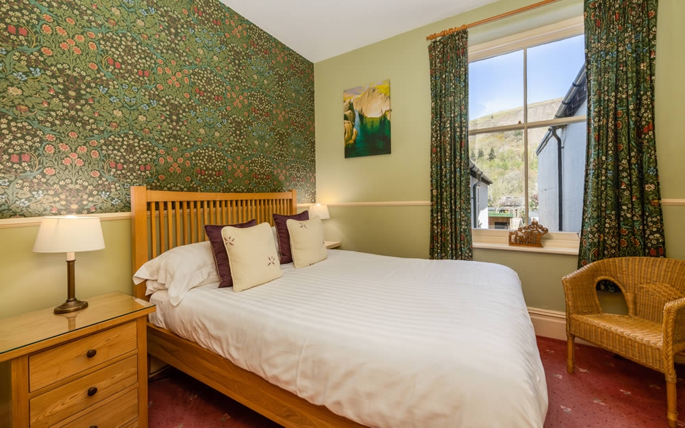 Room 1, cosy double room with William Morris Blackthorn wallpaper and fell-view window